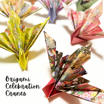 Colorful origami cranes on a light background with 'Origami Celebration Cranes' text.