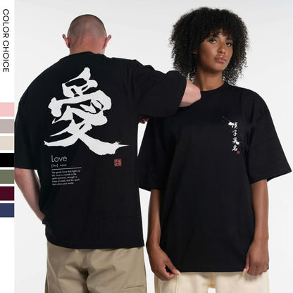 Two people wearing black t-shirts with Japanese kanji characters and English text on a white background.